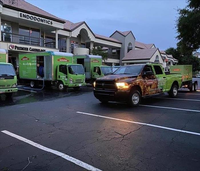 SERVPRO Vehicles in front of a Commercial Building