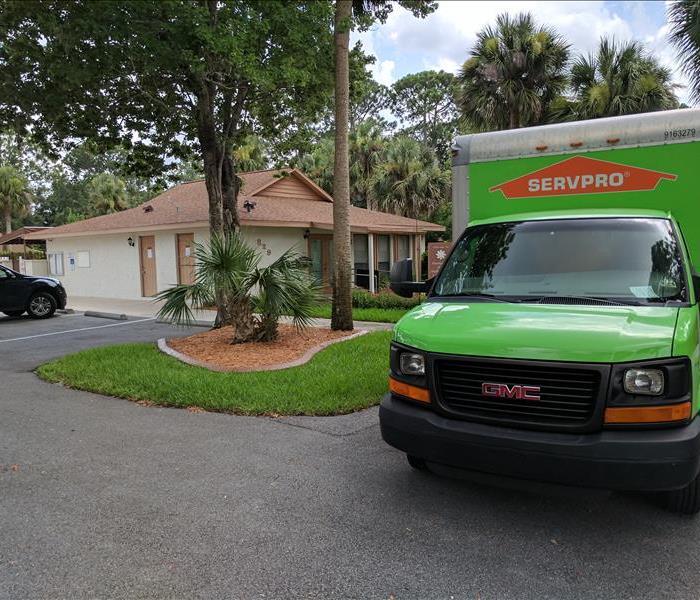 SERVPRO Vehicles in front of commercial building